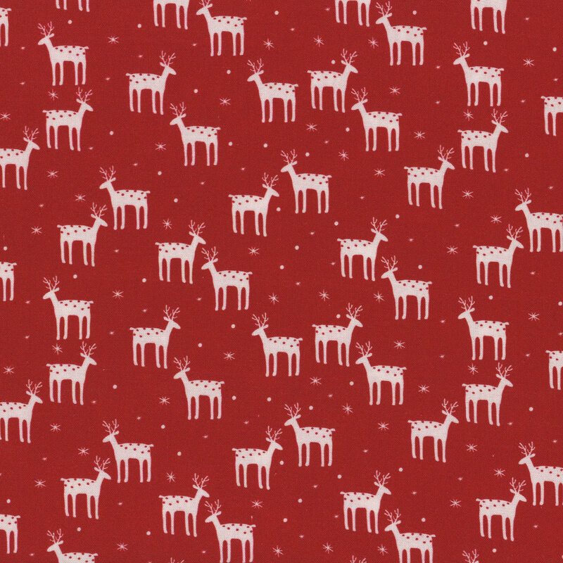 Red fabric with cream reindeer and snowflakes.