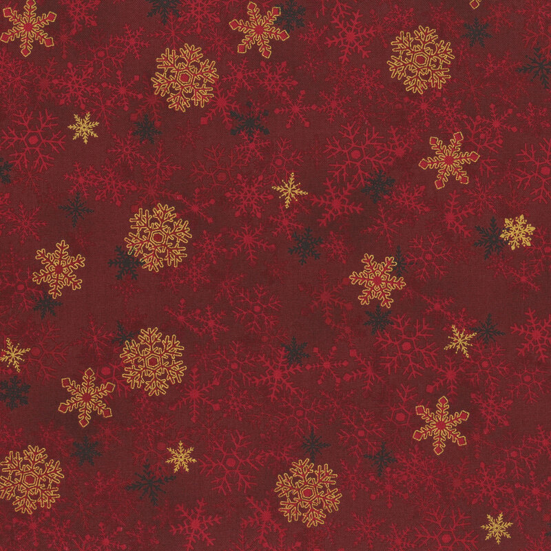 Burgundy fabric with tonal snowflakes and gold accents.