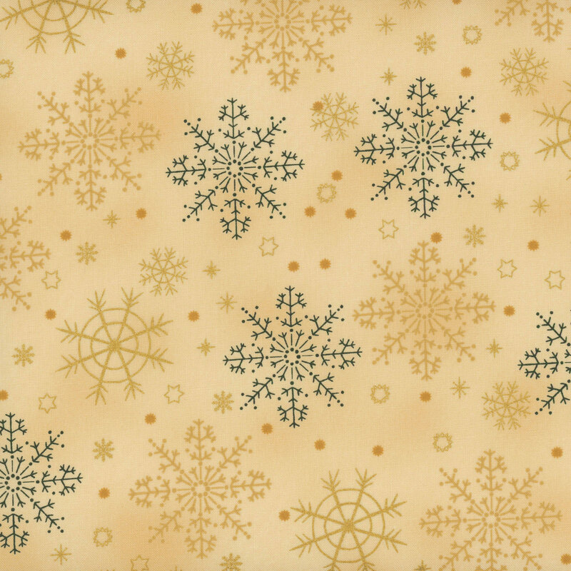 Warm beige fabric featuring large tonal and green snowflake designs with gold metallic accents.