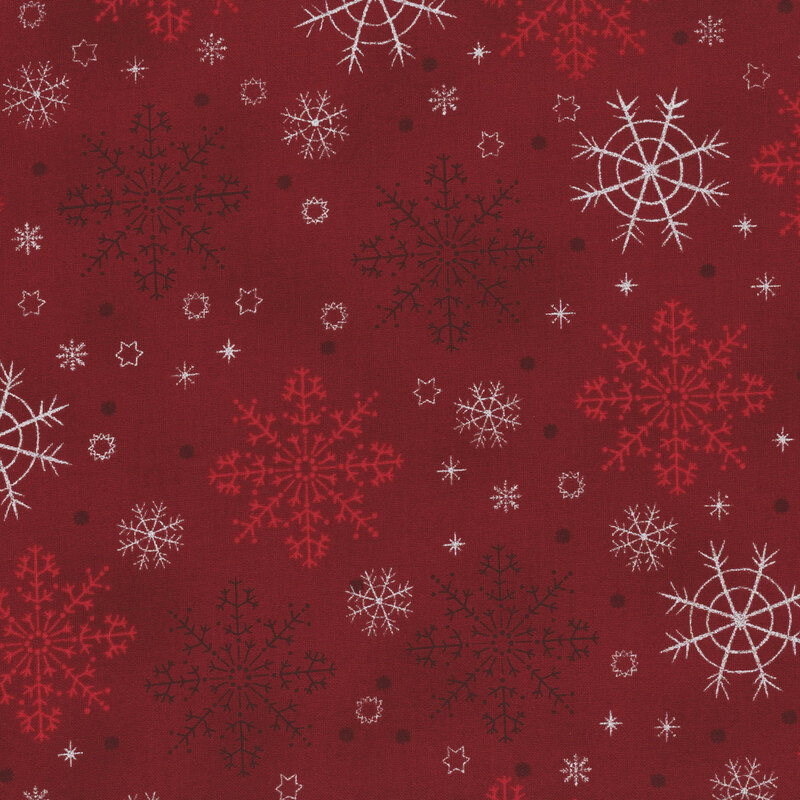 Mottled red fabric with large tonal and silver metallic snowflake designs.