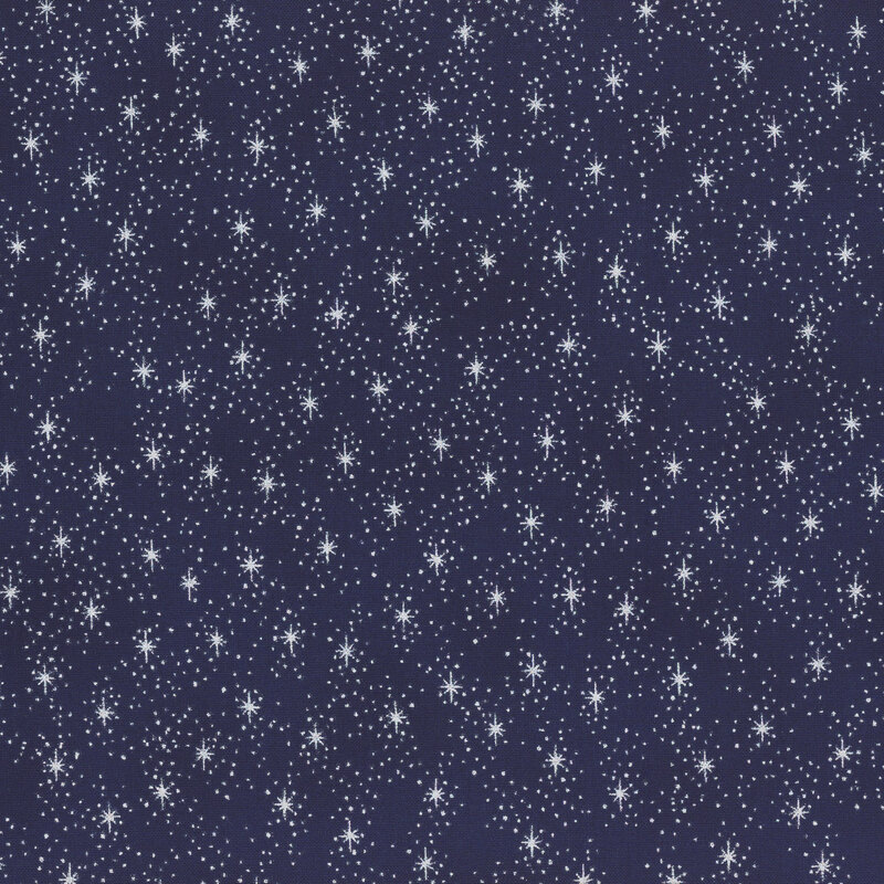 Mottled dark blue fabric with silver metallic stars and pin dots.