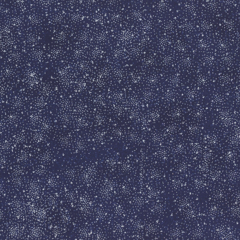 Mottled dark blue fabric stippled with silver pin dots.