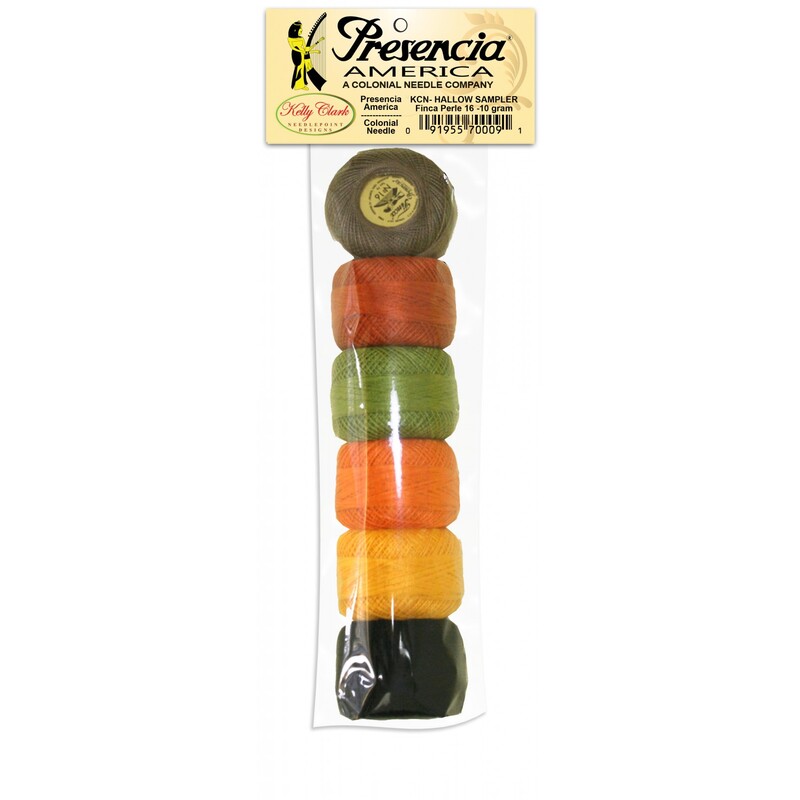 Six balls of perle cotton floss packaged in an array of warm Autumn colors, isolated on a white background.