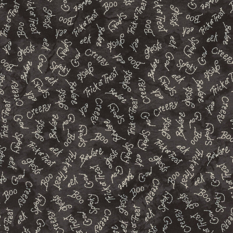 A dark background featuring random Halloween-themed words such as “Boo,” “Creepy,” and “Trick or Treat.”