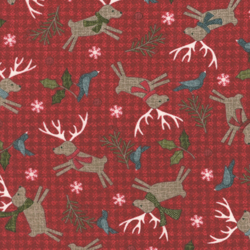 Red patterned fabric featuring reindeer with scarves, bluebirds, holly, and snowflakes.