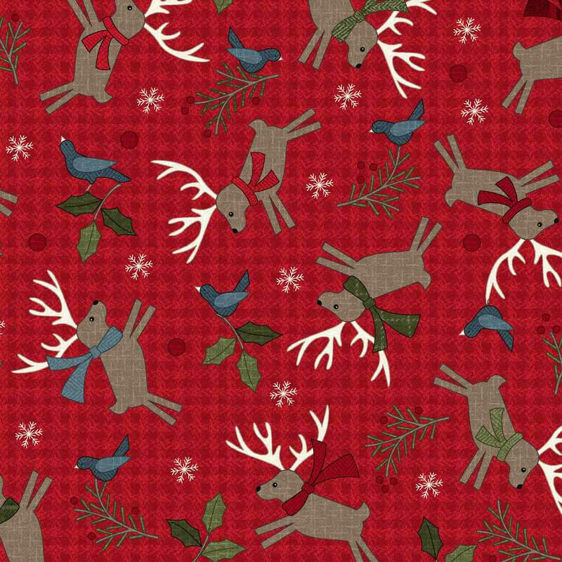 Red patterned fabric featuring reindeer with scarves, bluebirds, holly, and snowflakes.