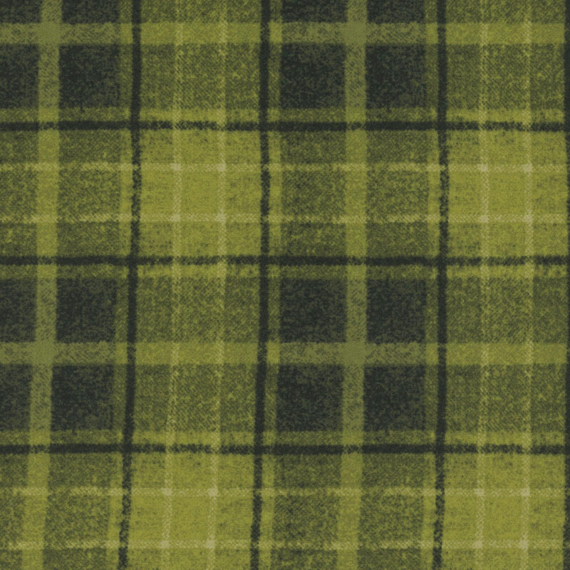 Green plaid fabric pattern featuring varying shades of green with black lines.