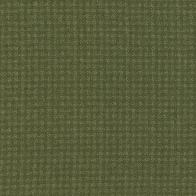Dark green fabric pattern with a subtle grid design.