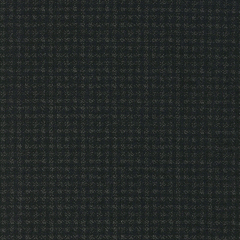 Dark plaid textile pattern with thin lines intersecting in a grid design.