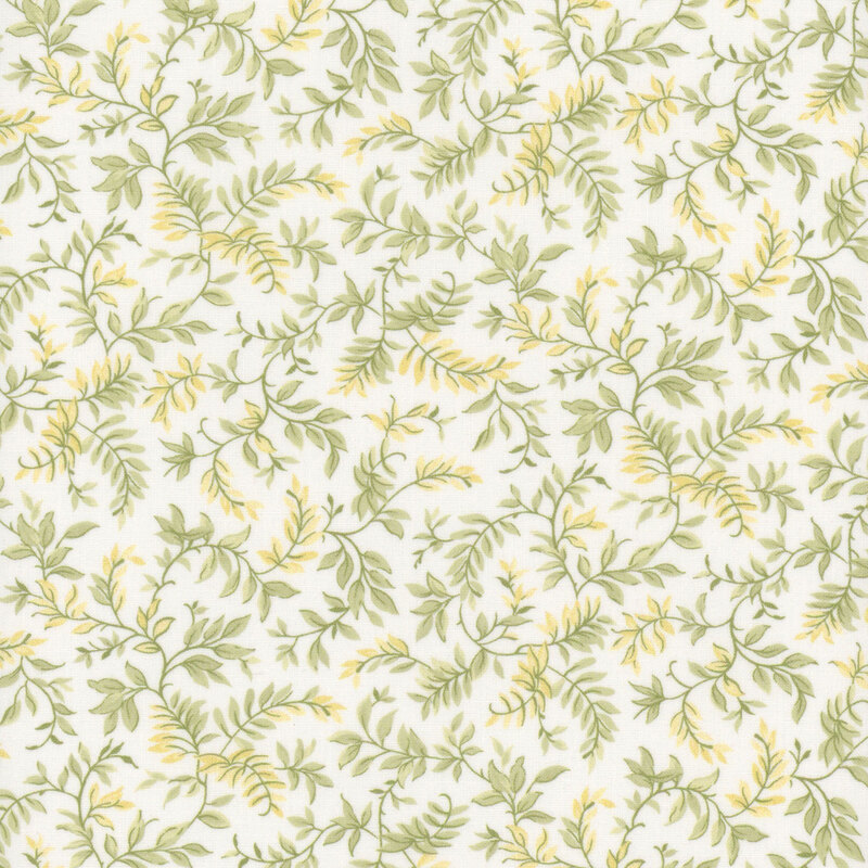 White fabric with sage green and yellow leaves.