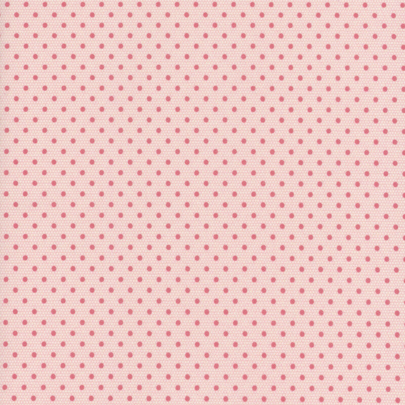 Light blush pink fabric swatch with tonal medium pink polka dots.