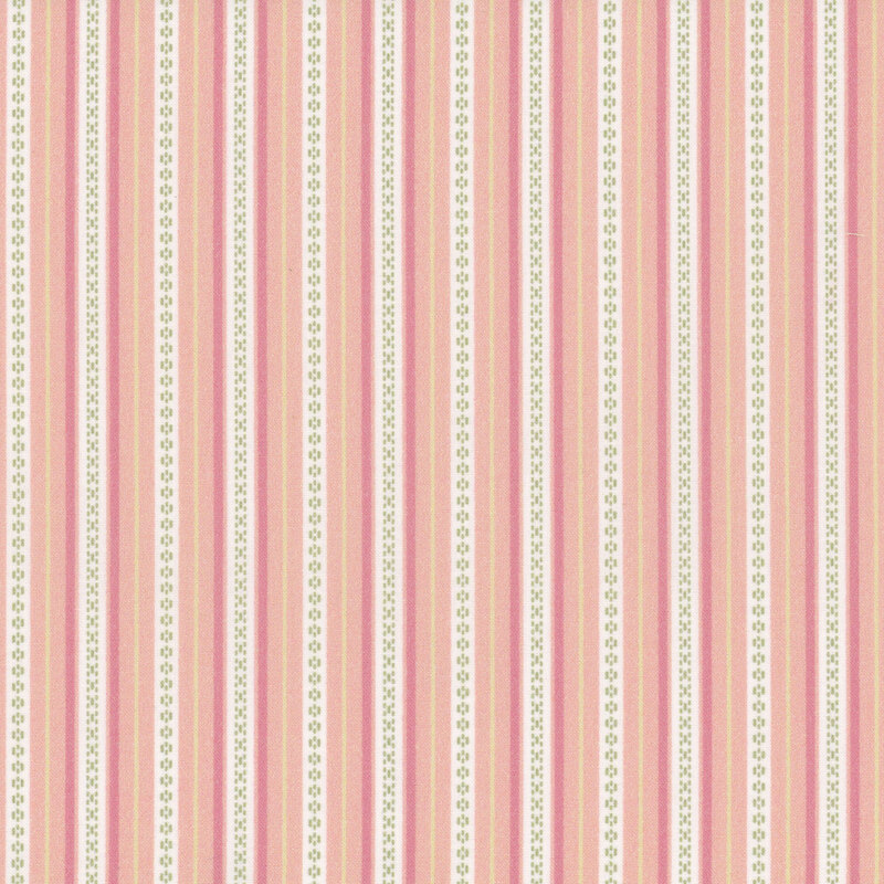 Fabric with vertical stripes of pink, dark pink, and cream with green stitch motifs.