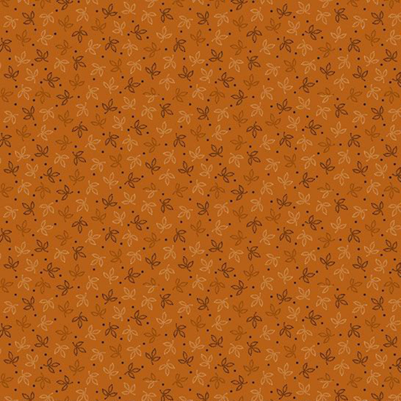 Rich orange fabric with small tricolor tonal leaves and polka dots.