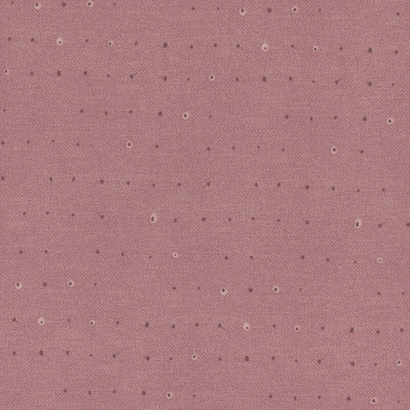 Tonal dots on a lightly textured light mauve background.