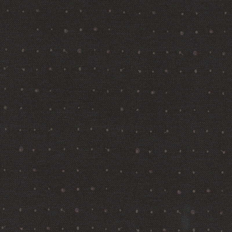 Tonal dots on a lightly textured black background.