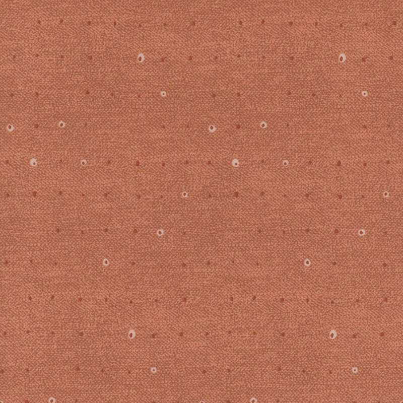 Tonal dots on a lightly textured terra cotta background.