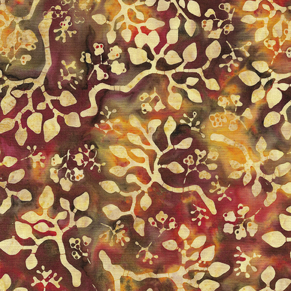 Mottled fabric featuring a floral and vine pattern in warm gold, red, and brown tones.