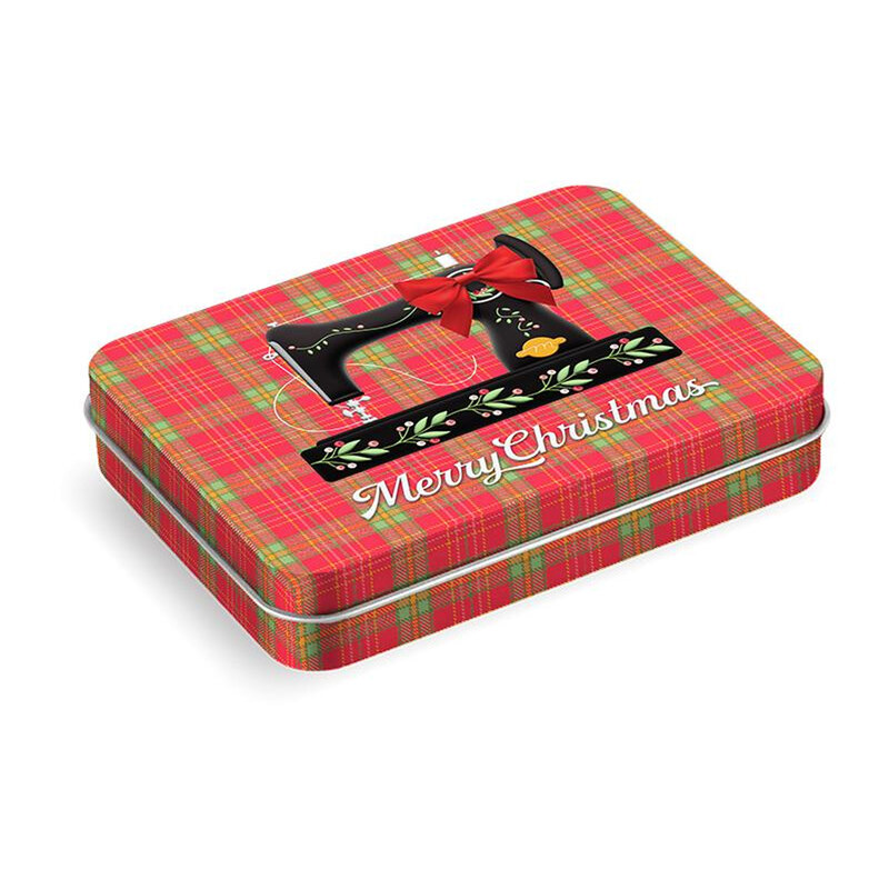 Red and green plaid Christmas tin with Merry Christmas and a decorative sewing machine design.