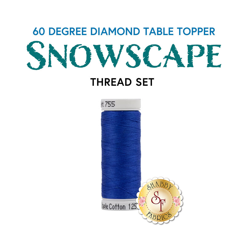 A spool of royal blue thread for the Snowscape 60 Degree Diamond Table Topper by Shabby Fabrics.