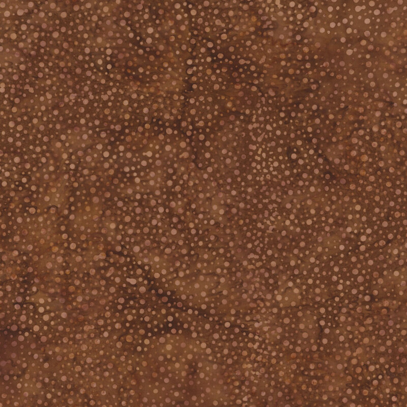 Abstract brown texture with varying circular dots in lighter shades, creating a speckled effect.