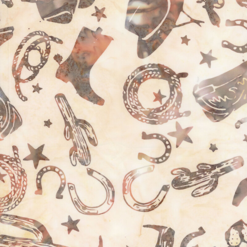 A fabric featuring western-themed icons such as cowboy boots, hats, cacti, and stars.