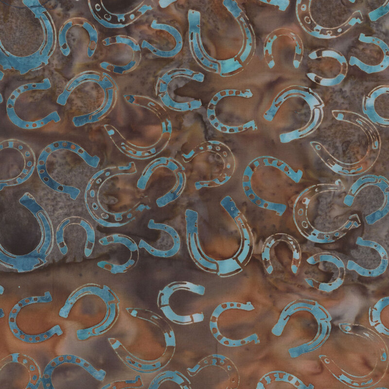 A pattern of overlapping blue horseshoes on a brown mottled fabric.