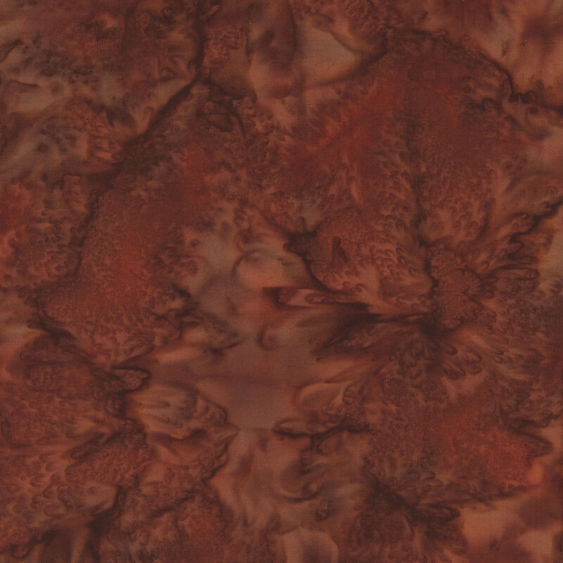 Abstract fabric in shades of brown, featuring swirls and marbled patterns.