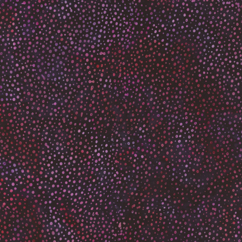 Abstract fabric pattern featuring a gradient of dots in shades of pink, purple, and navy blue.