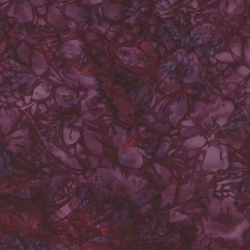 Abstract floral fabric in shades of deep purple, red, and hints of blue, with a mottled appearance.