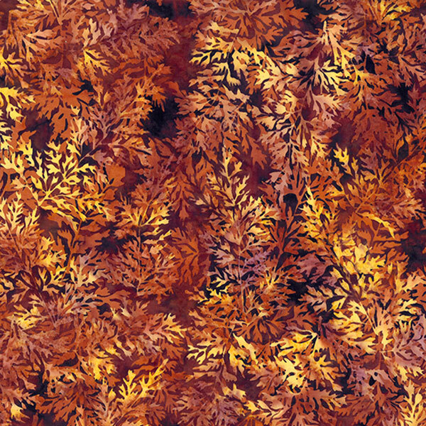 A vibrant fabric with orange and yellow leaves against a dark background, evoking autumn foliage.