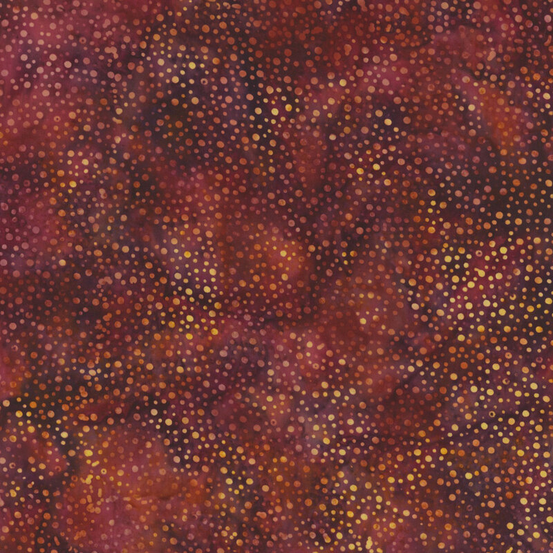 Abstract fabric featuring a textured background of dark red and maroon hues with gold dot accents.