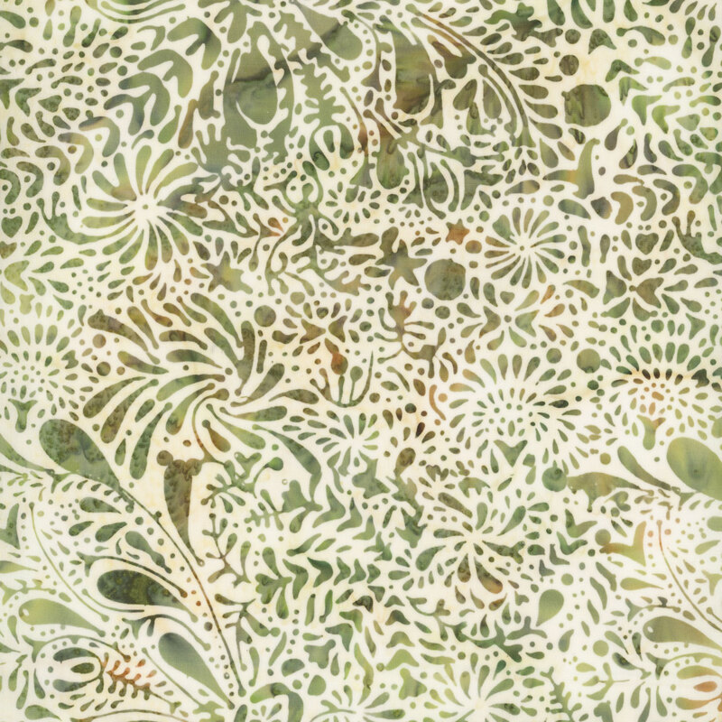 Cream batik fabric with abstract mottled leaf and vine pattern in green and warm brown.