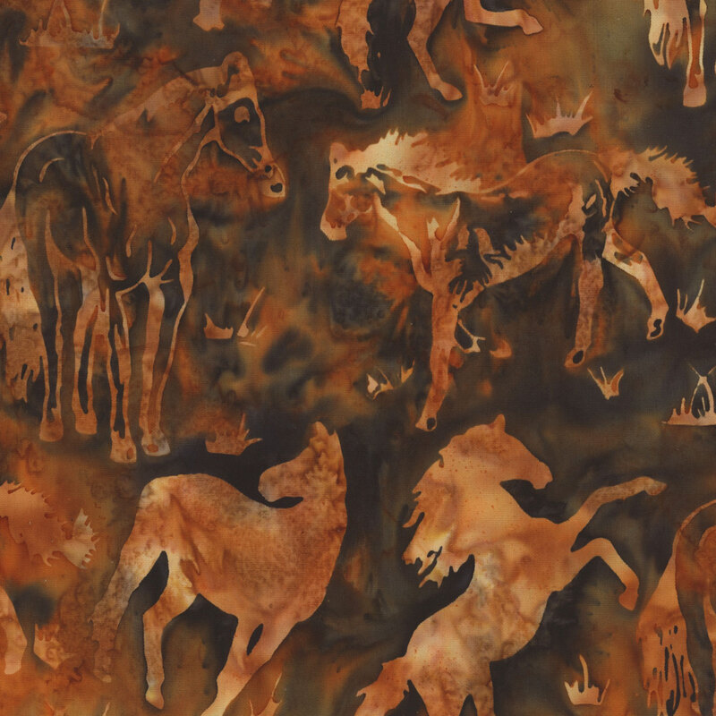 Batik fabric with vibrant orange and dark spruce mottling and silhouettes of pale orange horses.