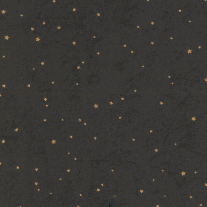 A charcoal textured fabric scattered with small, gold stars.