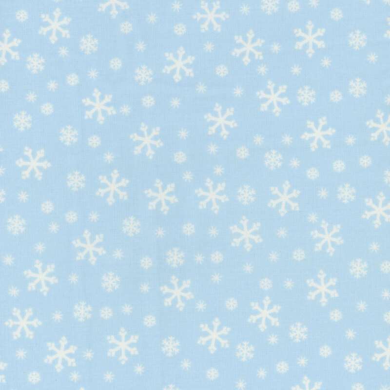 Powder blue fabric with tossed white, tonal light blue, and cyan snowflake designs.