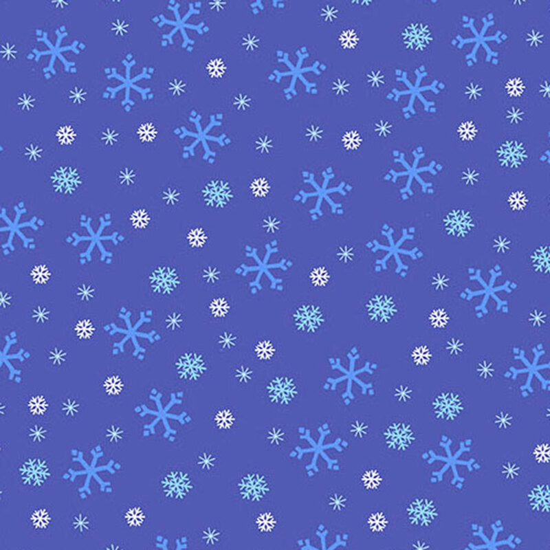 Indigo blue fabric with tossed white, tonal blue, and cyan snowflake designs.