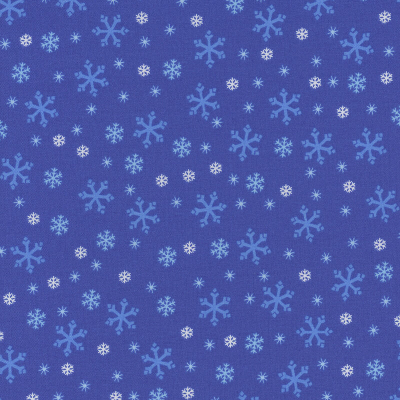 Indigo blue fabric with tossed white, tonal blue, and cyan snowflake designs.