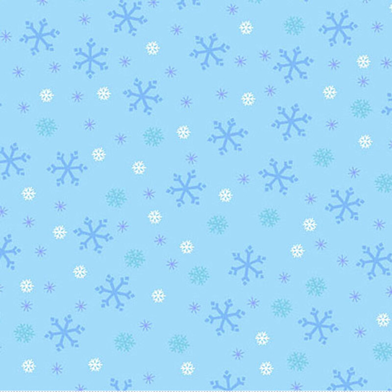 Sky blue fabric with tossed white, tonal blue, and cyan snowflake designs.