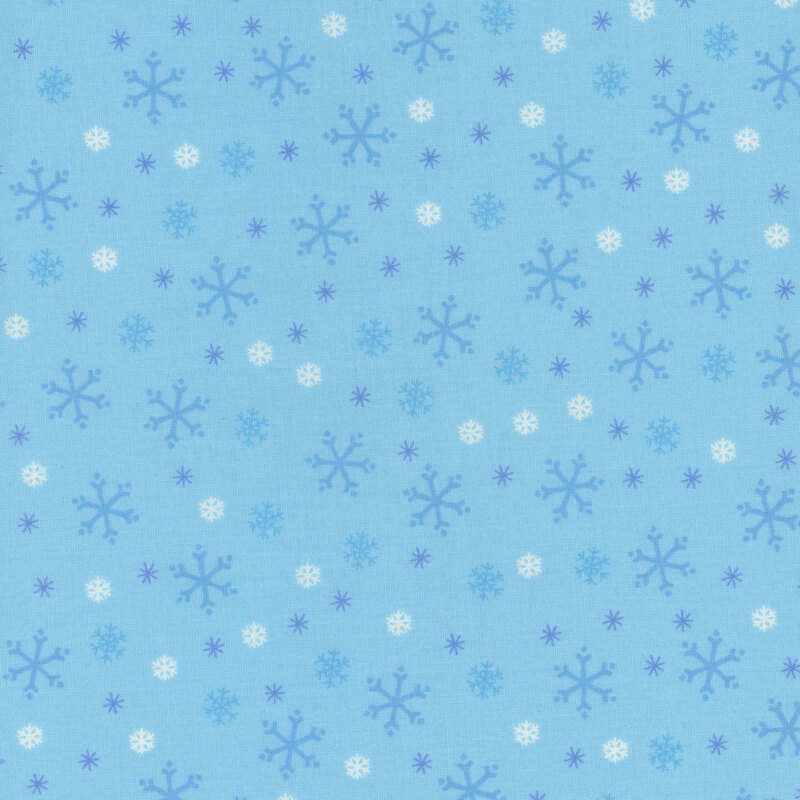 Sky blue fabric with tossed white, tonal blue, and cyan snowflake designs.