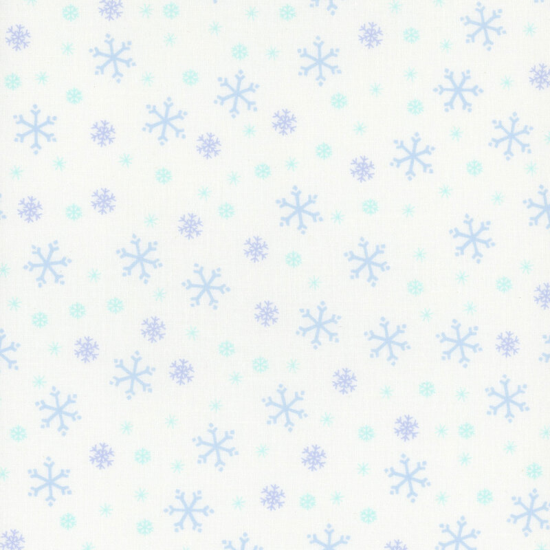 White fabric with tossed blue and cyan snowflake designs.