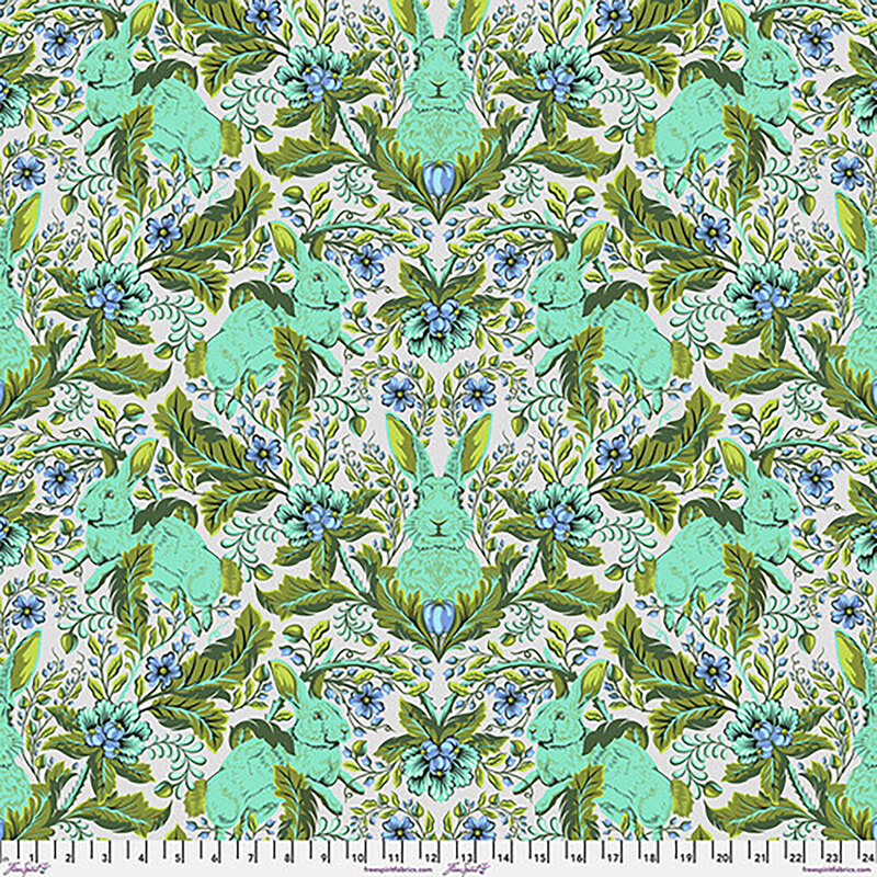 A repeating pattern featuring turquoise rabbits and blue flowers on a white background.