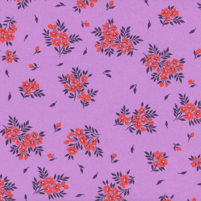 Fabric swatch of small red flowers and leaves on a bright orchid purple background.