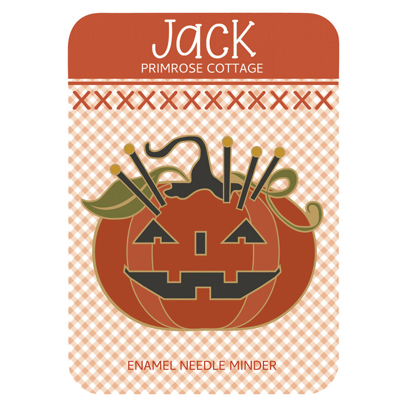 The jack-o-lantern needle minder in its packaging, isolated on a white background.