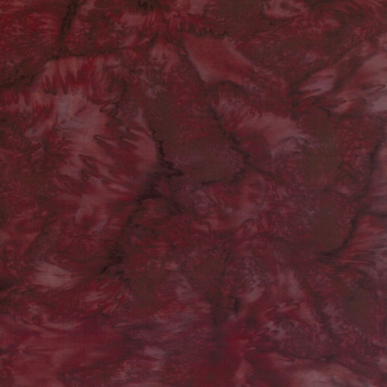 fabric with deep burgundy tones with swirling, marbled patterns.