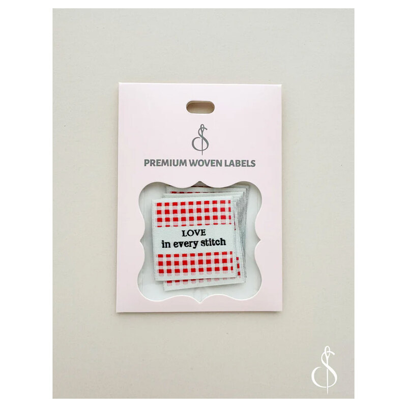 A package of premium woven sew-in labels displayed on a white background.