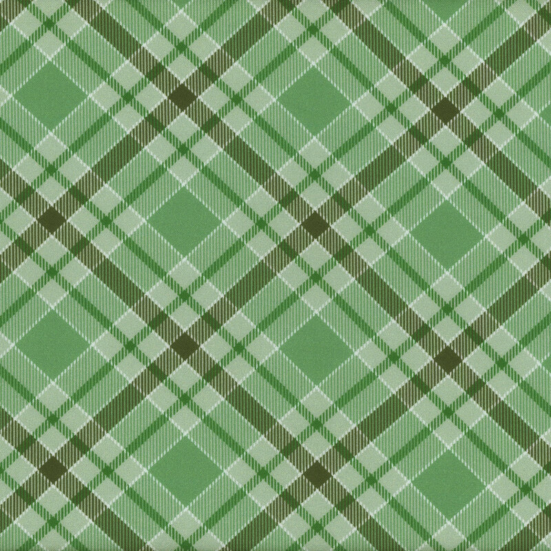 Green plaid fabric pattern featuring various shades of green and white intersecting lines.