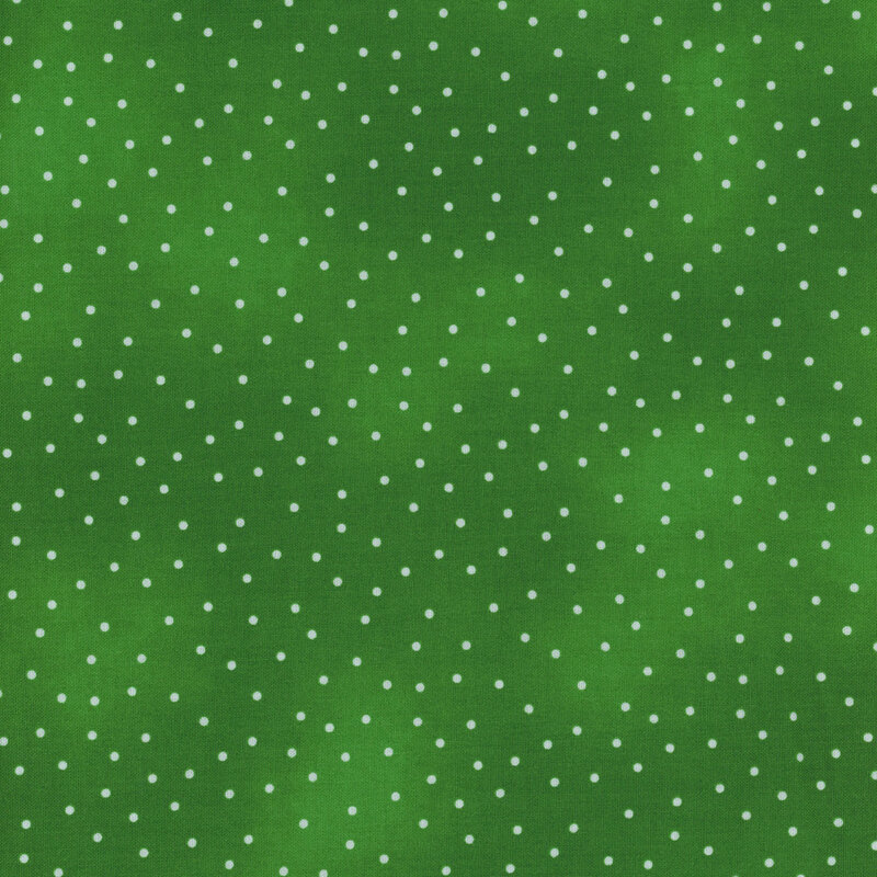 Small pinprick dots scattered across a mottled green background.