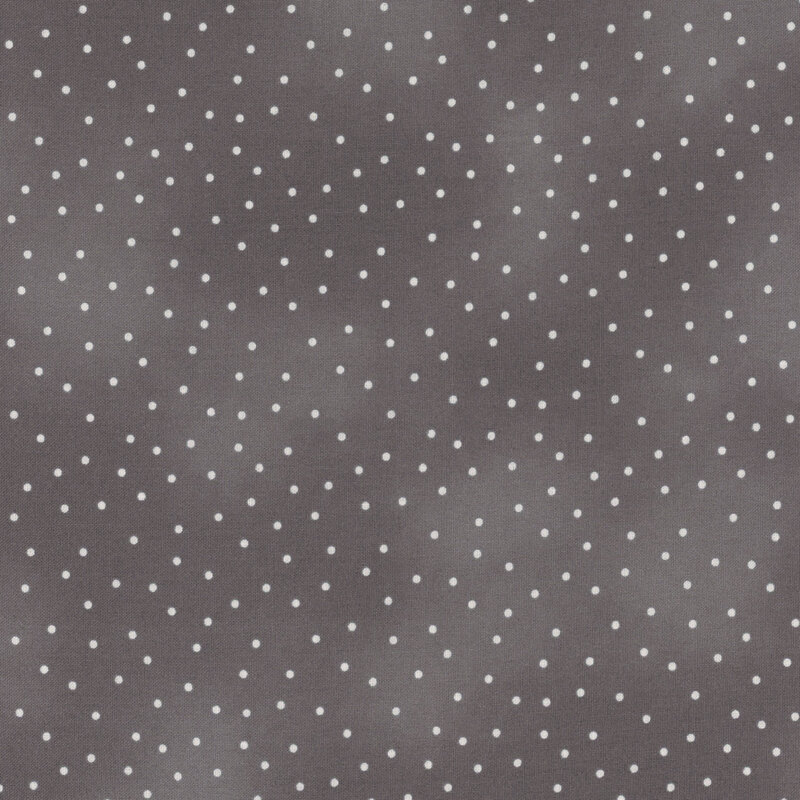 Small pinprick dots scattered across a mottled dark gray background.