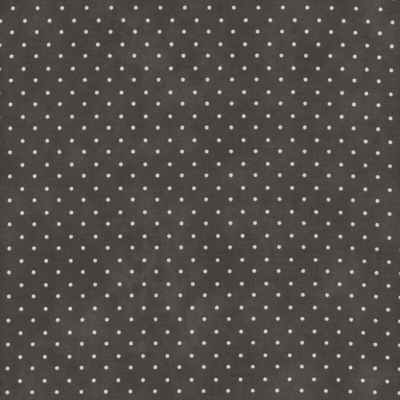 Mottled gray fabric with an even pattern of polka dots.