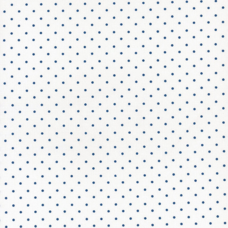 White fabric with an even pattern of navy polka dots.